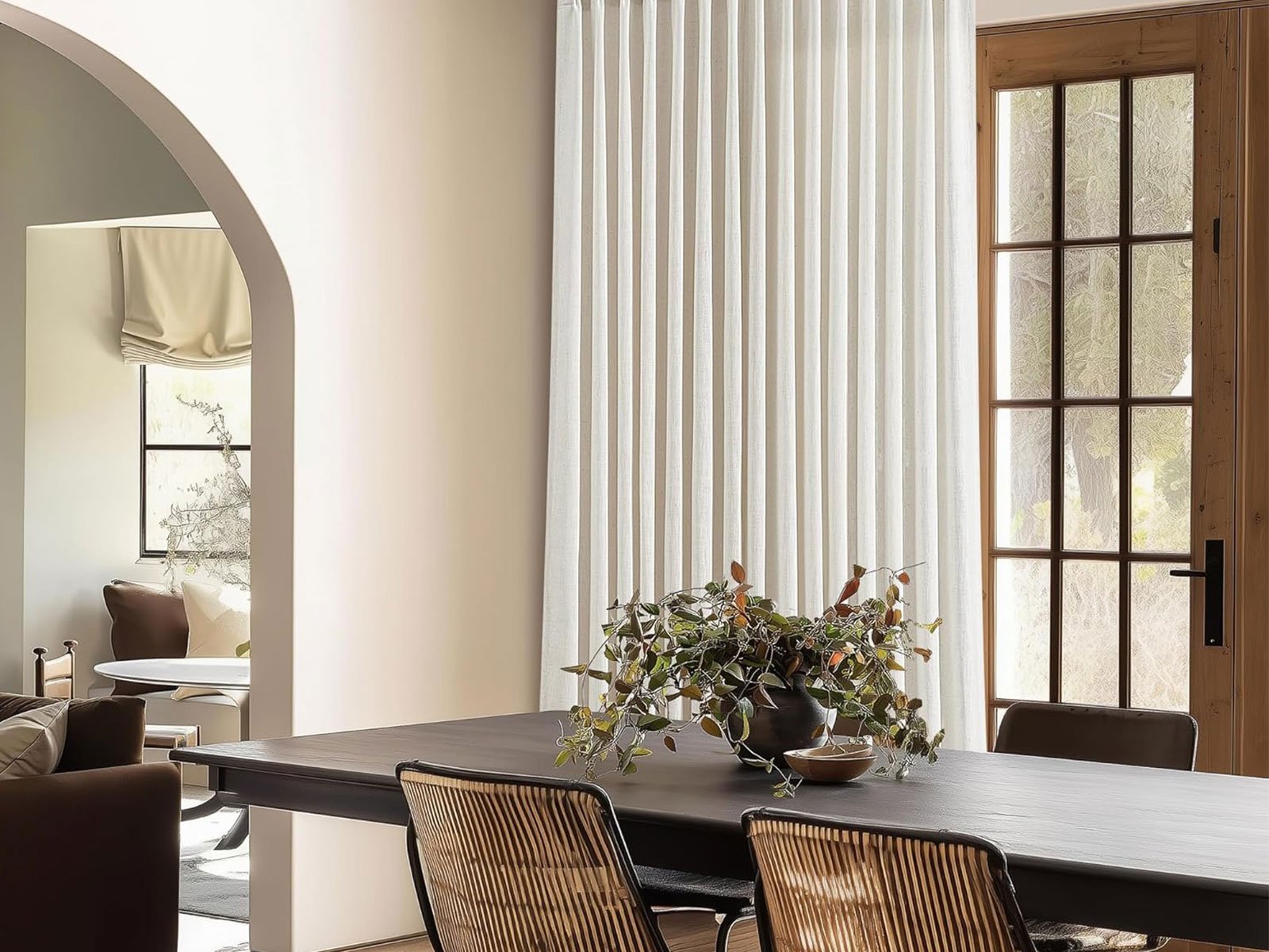 Pinch pleat curtains installed on large windows and sliding glass doors