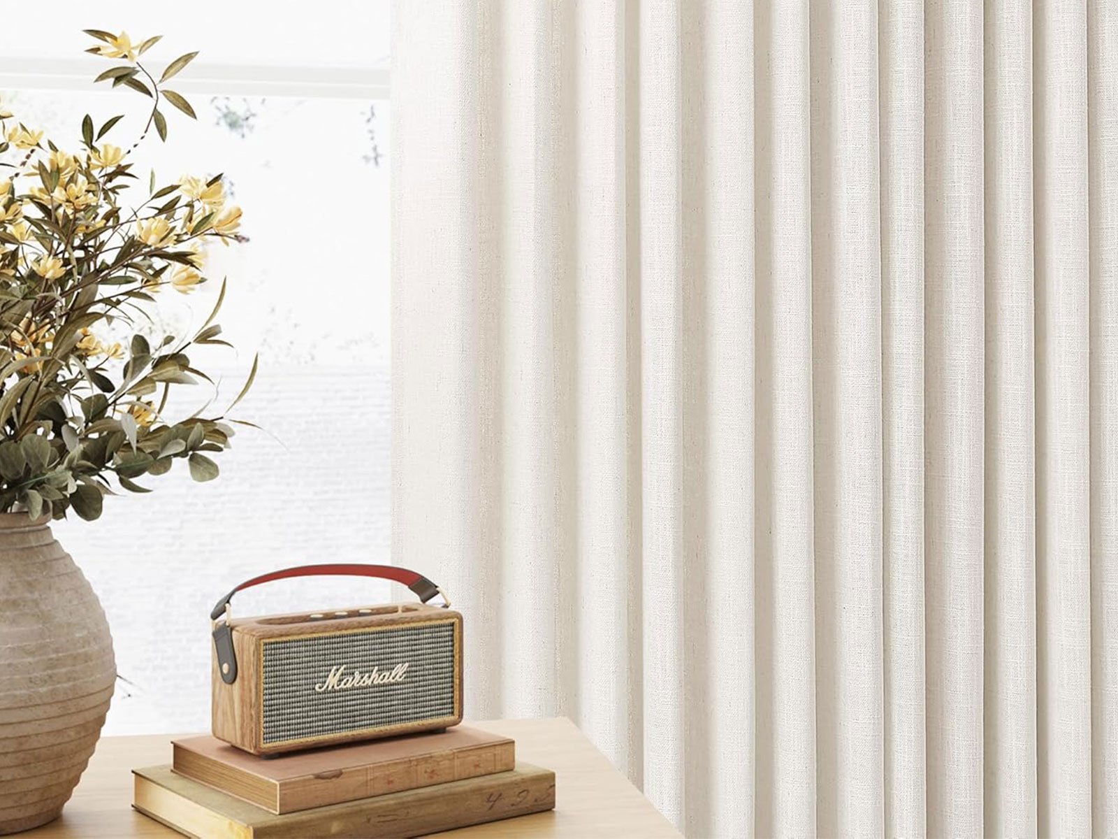 Pinch pleat drapes with full and luxurious folds from ceiling to floor